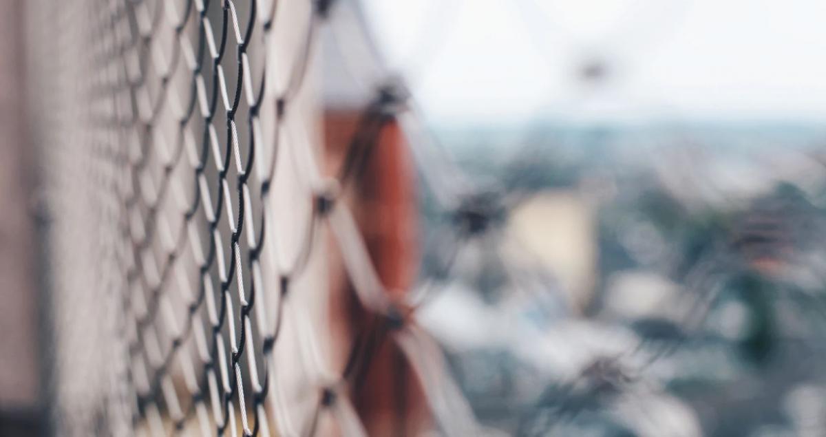 selective focus photo of a fence courtesy of Unsplash