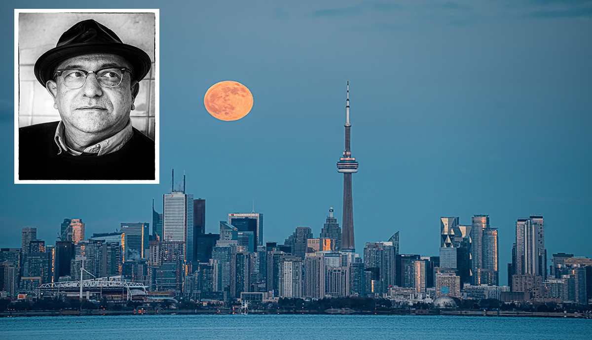 Black and White Photo of Grant Tracey placed on top of the Toronto skyline