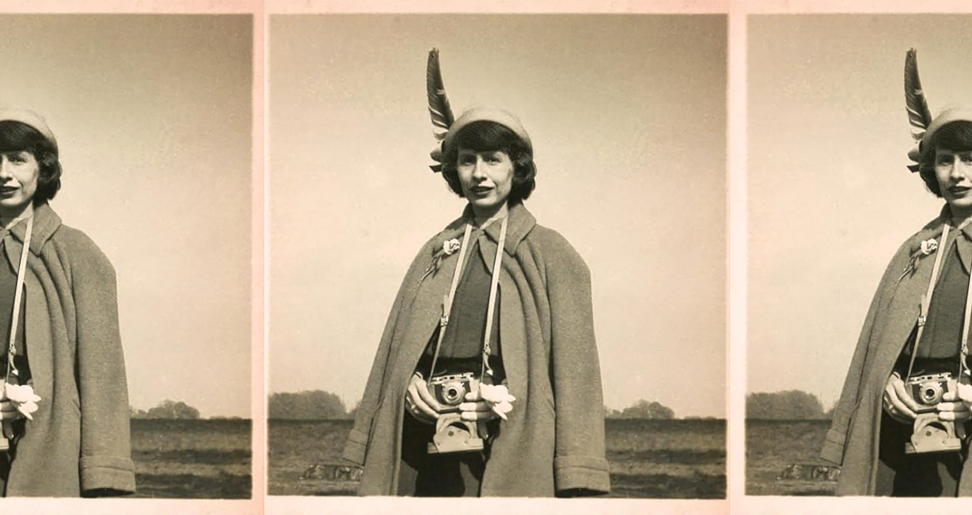 Amy Clampitt holding a camera