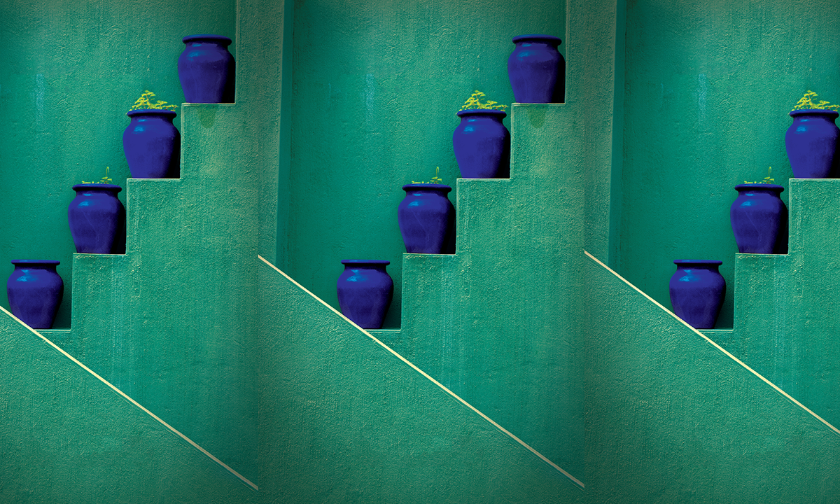 blue vases on green stairs