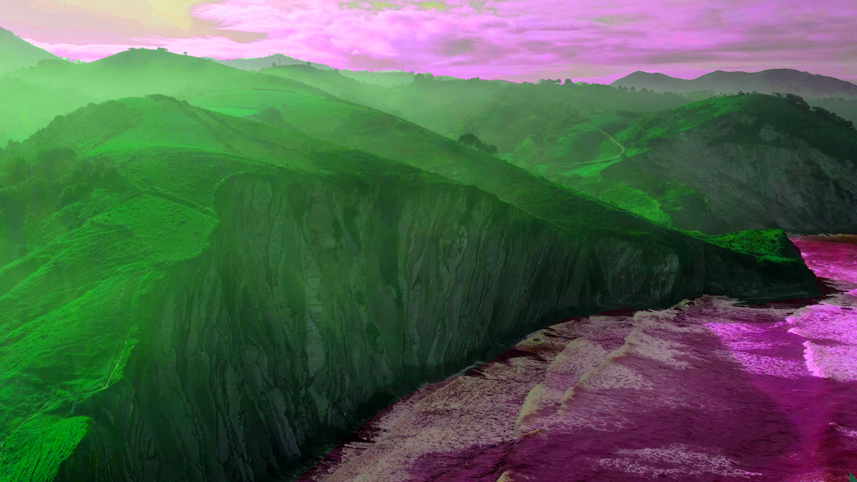 Green cliffs, violet ocean and sky
