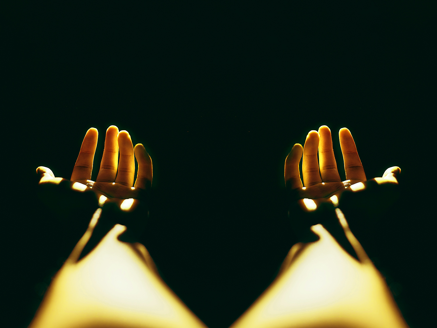 hands reaching in the dark