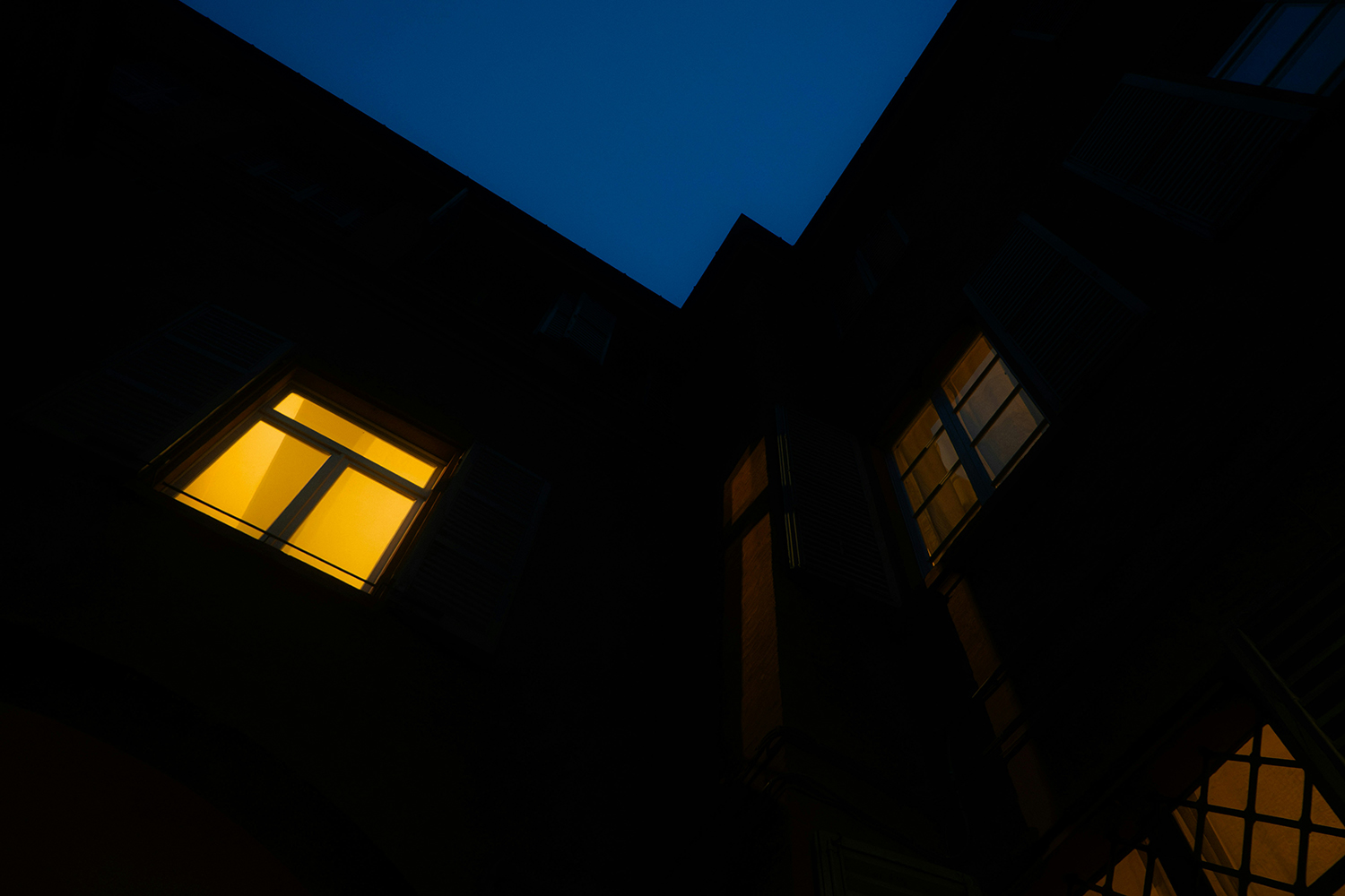 House with window lit up at night