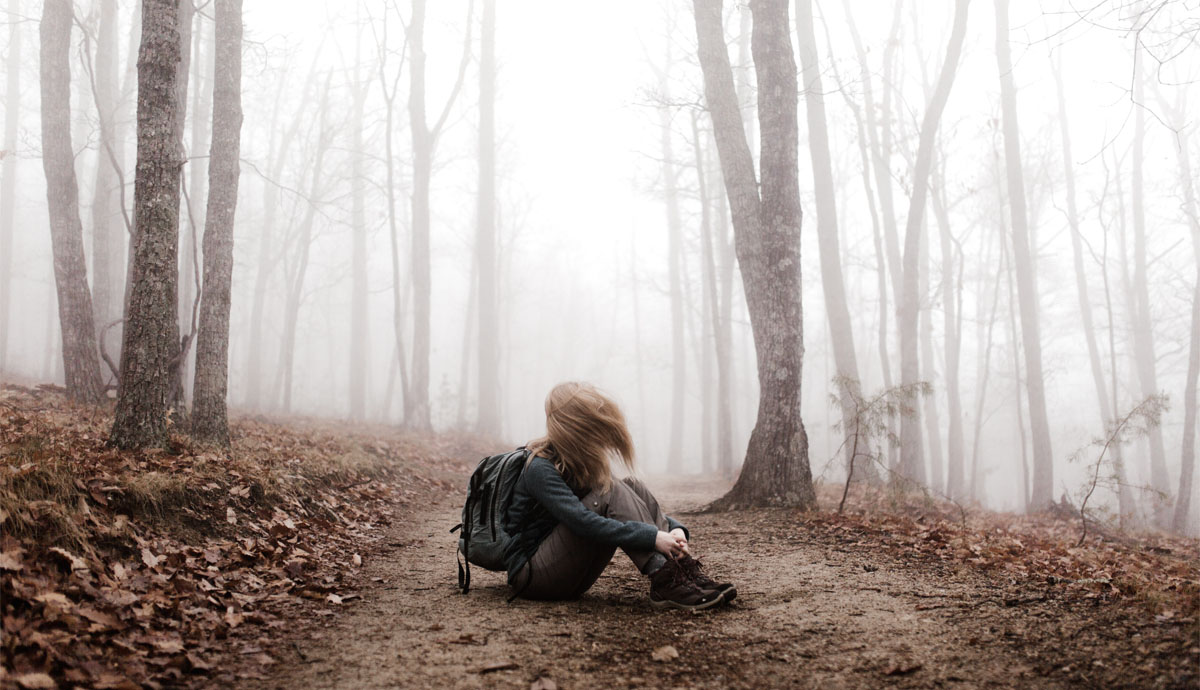 Woman sitting on land | Andrew Neel