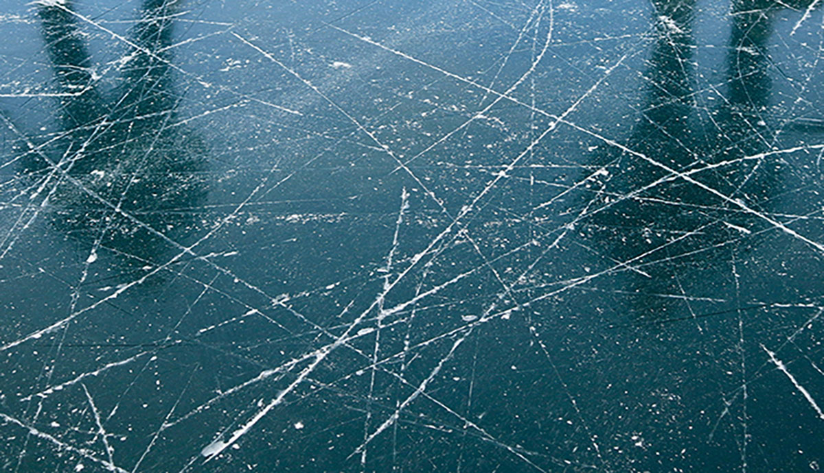 shadows of skaters on ice rink