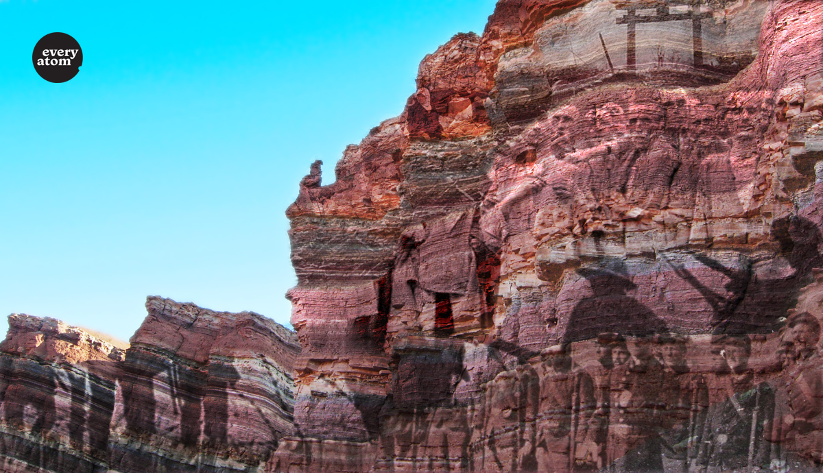 A cliff side with faint WWII imagery on it