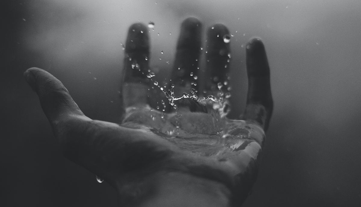 Header Graphic: Grayscale hand catching rain | Image Credit: Geetanjal Khanna via Unsplash