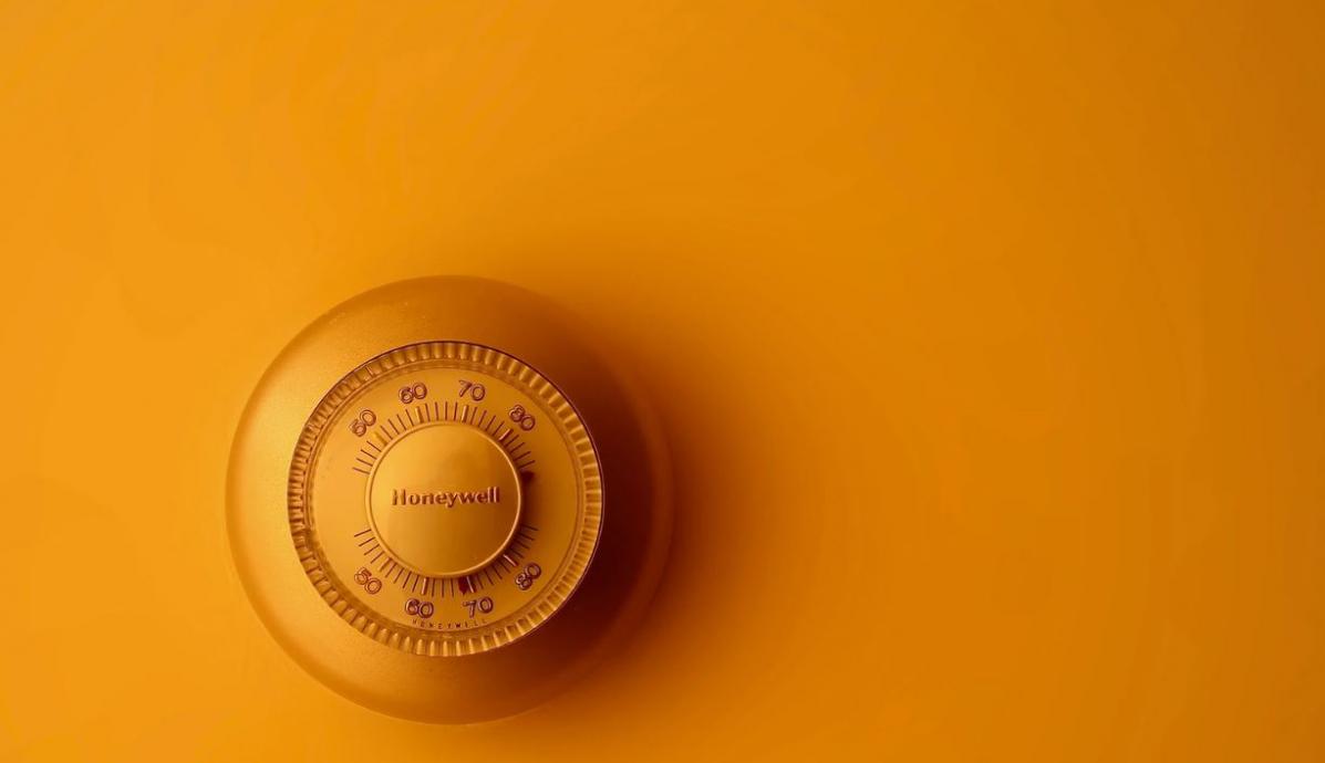 photo of a thermostat in yellow light