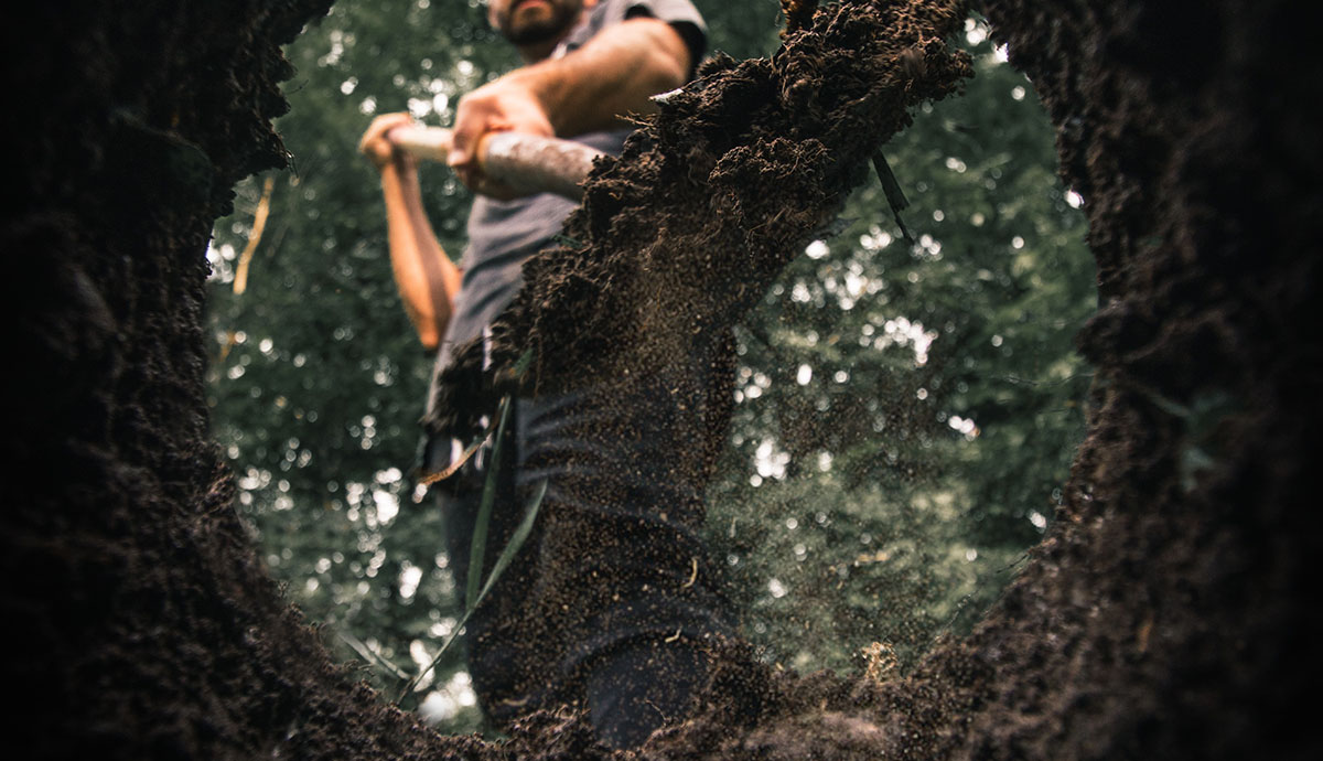 Header Graphic: Man shoveling dirt into a hole | Unsplash: Daniel Lincoln