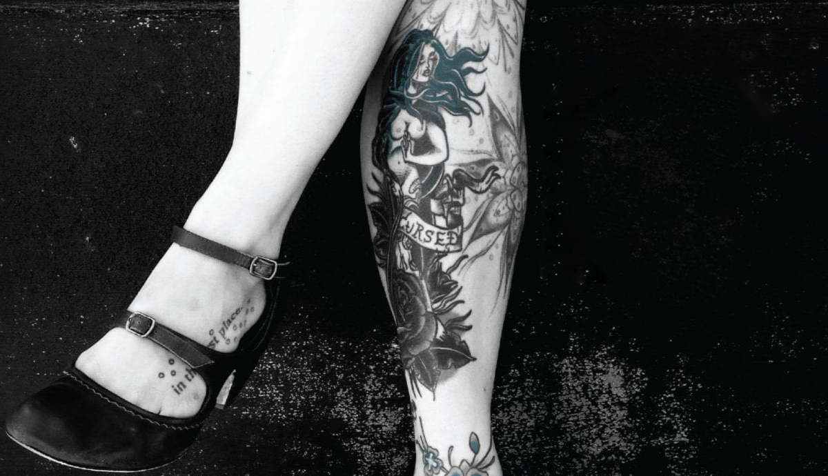 Image of tattooed legs from book cover