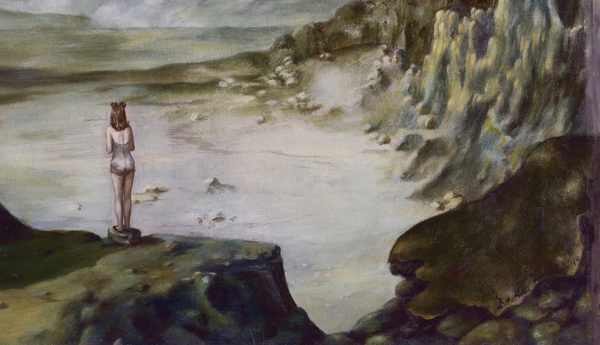 Woman in barren mountainous landscape