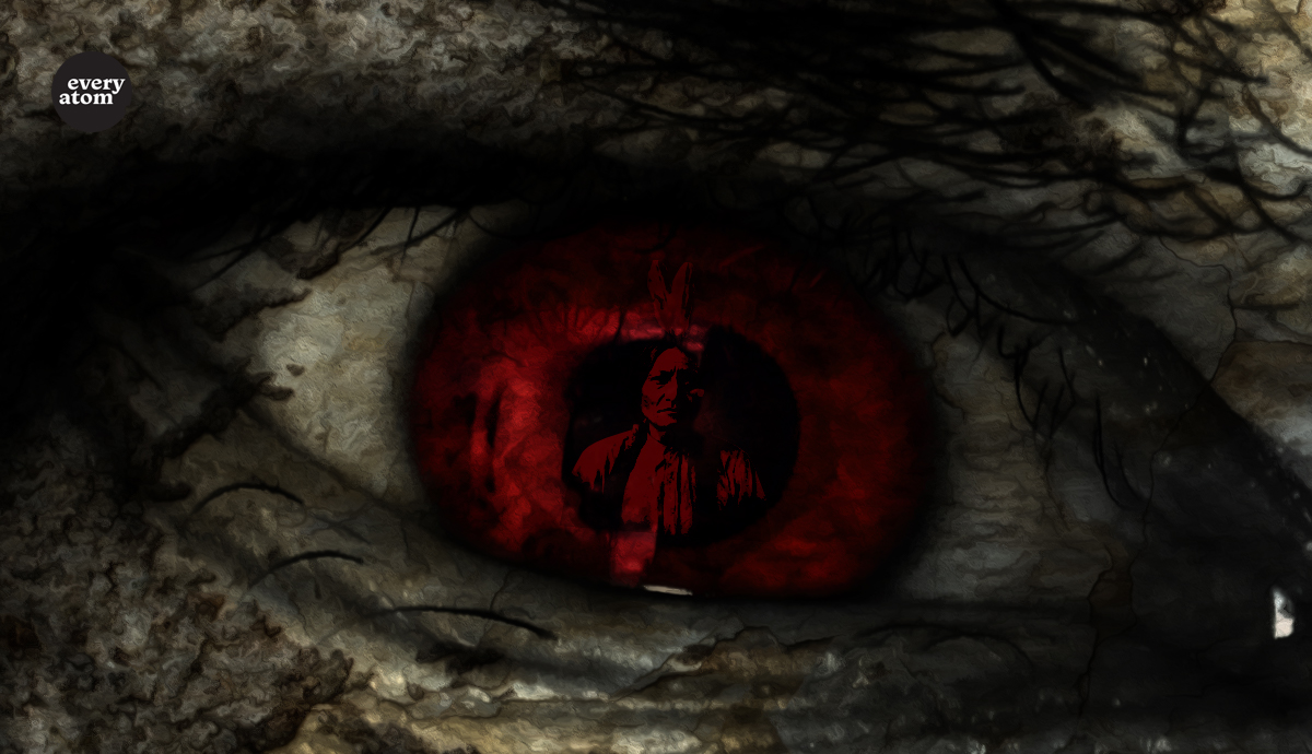 Dark eye with red iris with image of a Native American inside