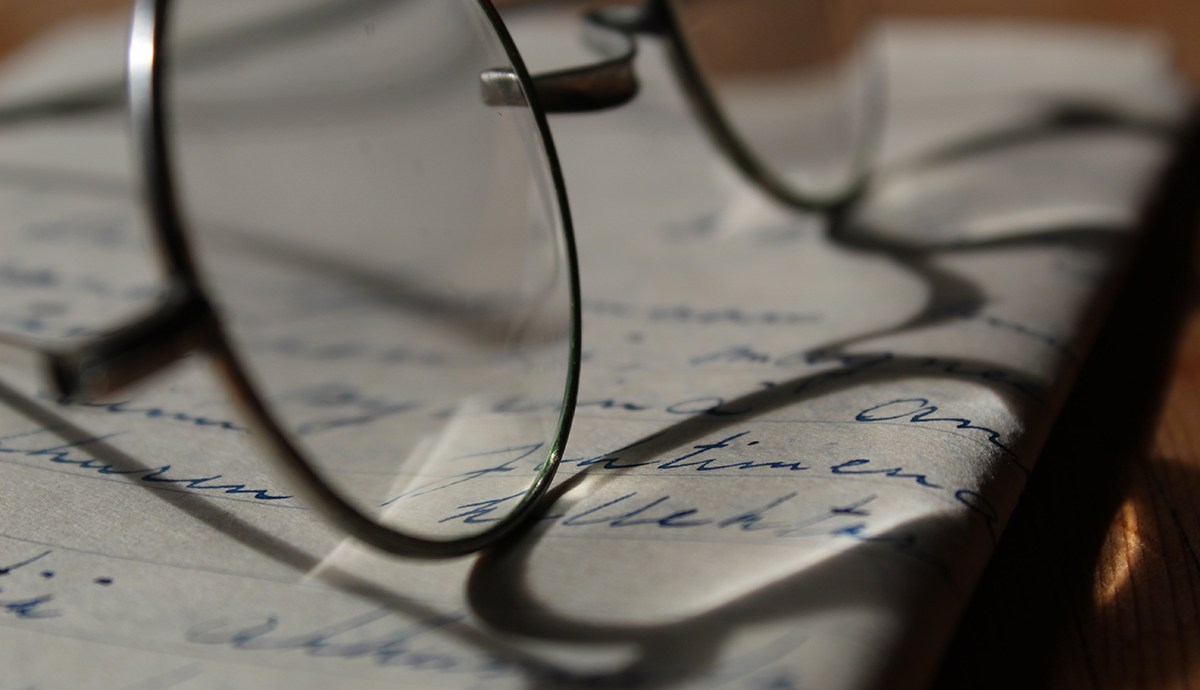 Header Graphic: Spectacles resting atop an open book | Image Credit: Anne Nygard of Unsplash