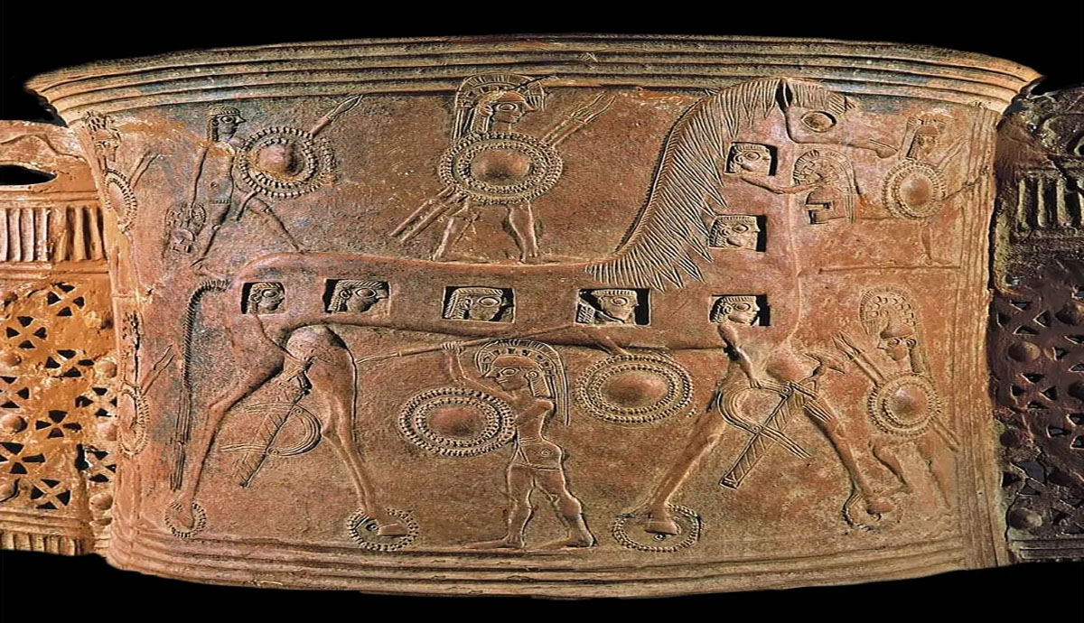 Header Graphic: Aged Greek Pottery with warriors and a giant horse | Image Credit: Dos Madres Press