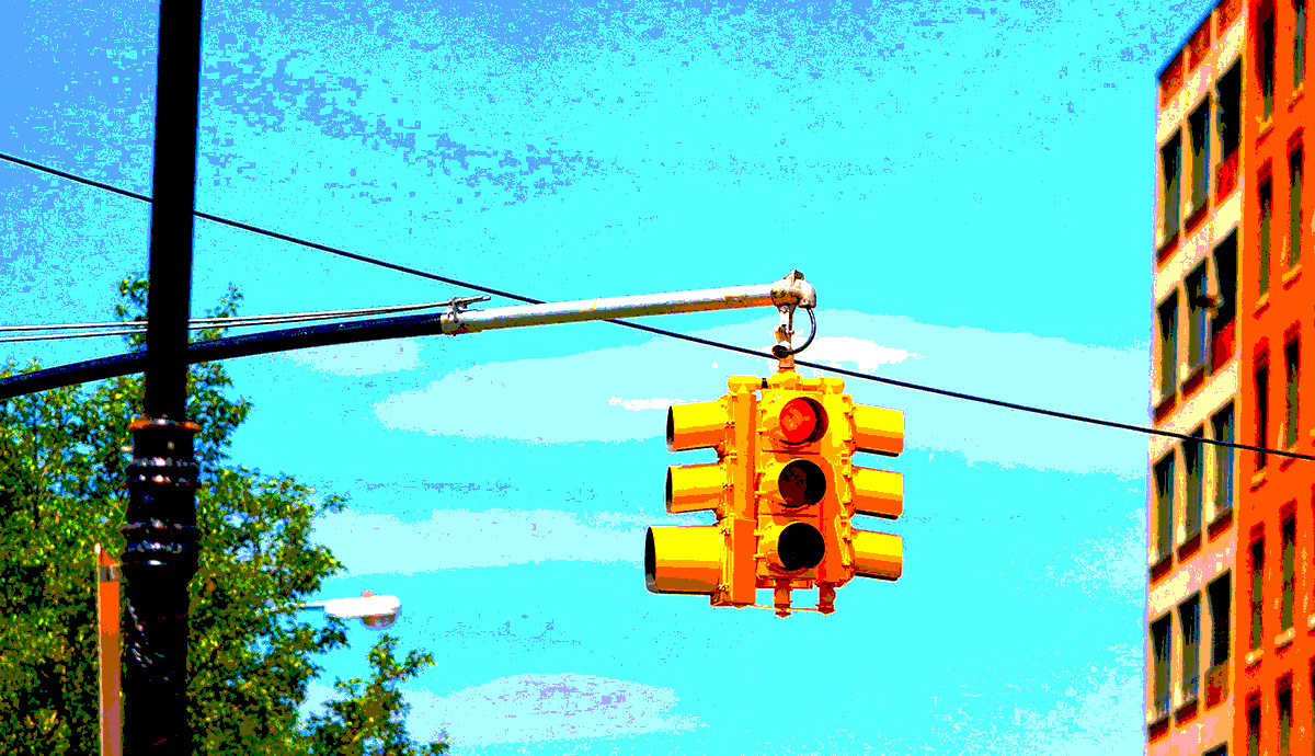 Header Graphic: Saturated and posterized image of a city stop light | Image Credit: Unsplash