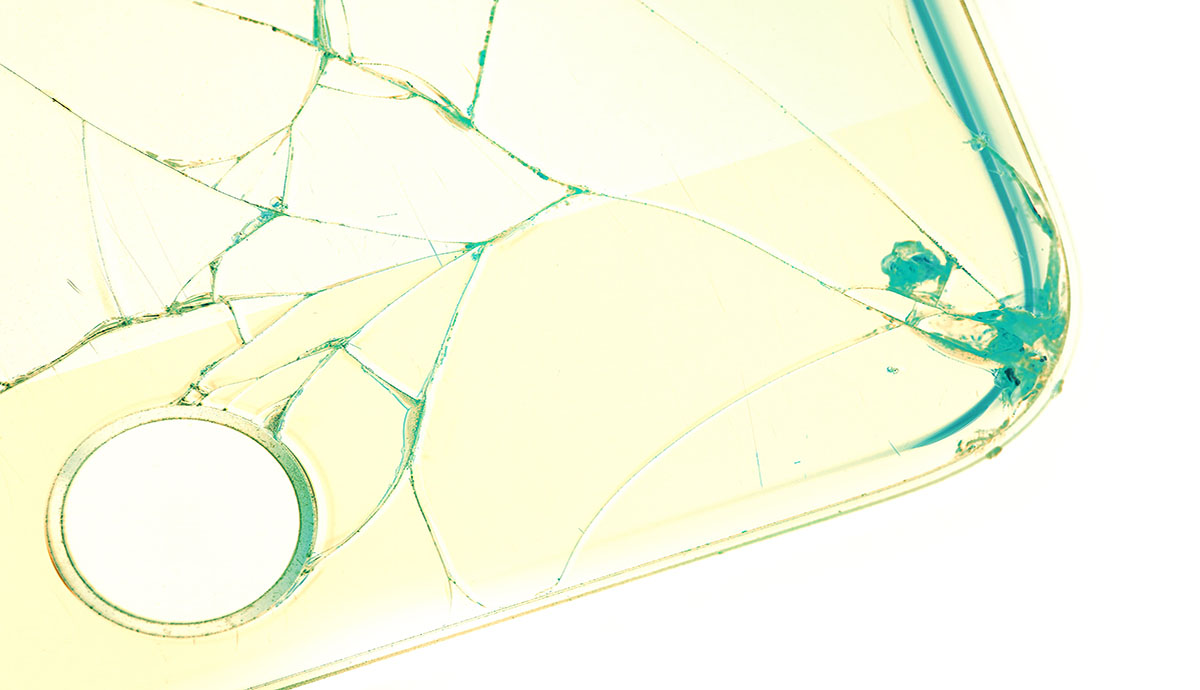 abstract photo of cracked glass, a green-ish yellow color