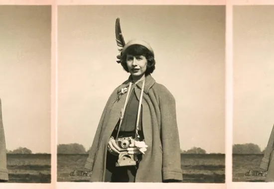 Amy Clampitt holding a camera