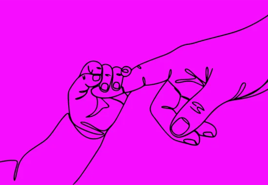 Baby gripping adult finger