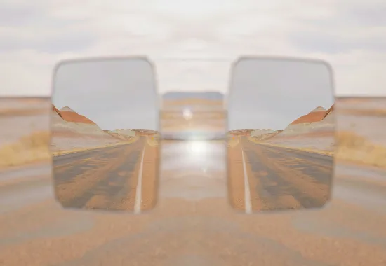 Car Mirror in Desert Landscape