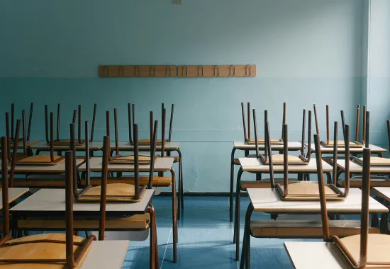 empty classroom, chairs on desks