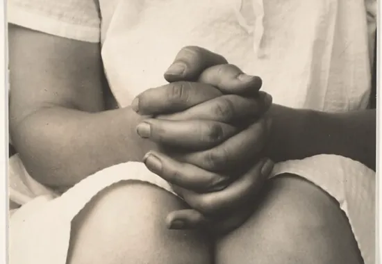 photograph of a woman's folded hands