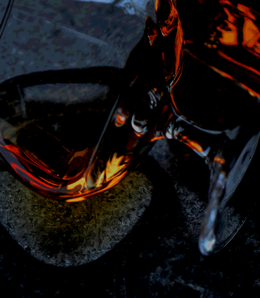 Header Graphic: Glass of deep ruby bourbon on its side | Image Credit: Pexels