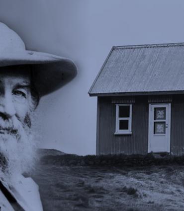 Whitman's figure next to a small home