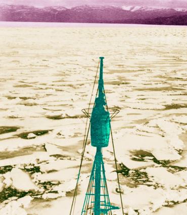 negatively colored ship mast amid an icescape 