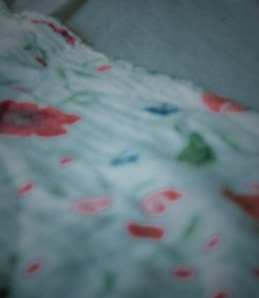 A floral-pattern bedspread.