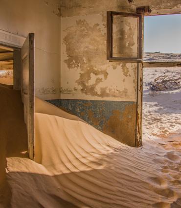 Abandoned house full of sand