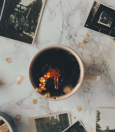 Header Graphic: Polaroids surrounding a mug of coffee | Image Credit: Annie Spratt on Unsplash