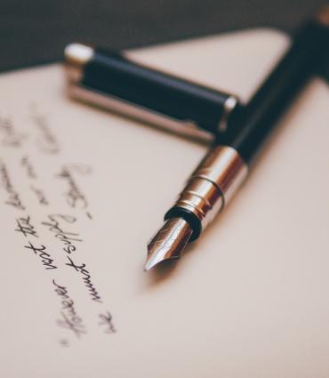 Header Graphic: Felt pen on top of paper dotted with notes | Image Credit: Unsplash