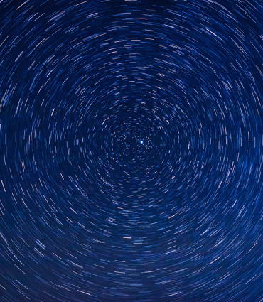 Header Graphic: Blue lights swirling in a circle | Image Credit: Fred Moon via Unsplash