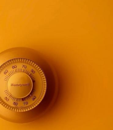 photo of a thermostat in yellow light