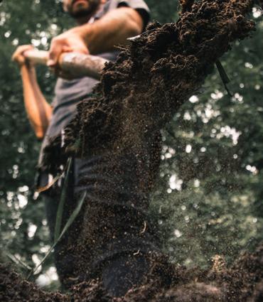 Header Graphic: Man shoveling dirt into a hole | Unsplash: Daniel Lincoln