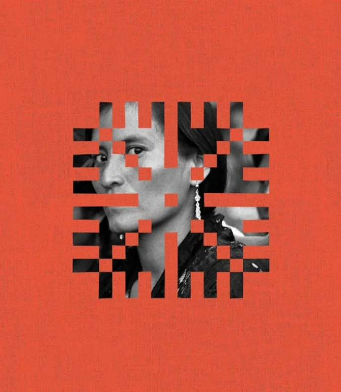 Black and white woman looking through orange design.jpg
