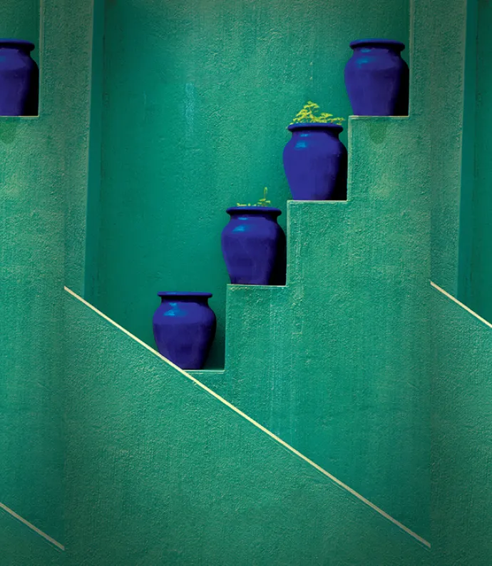 blue vases on green stairs