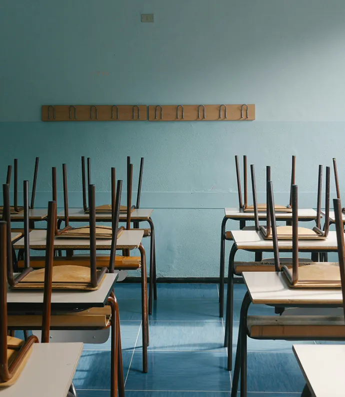 empty classroom, chairs on desks