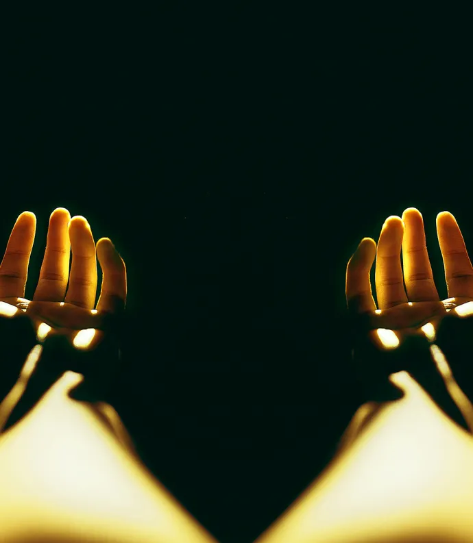 hands reaching in the dark