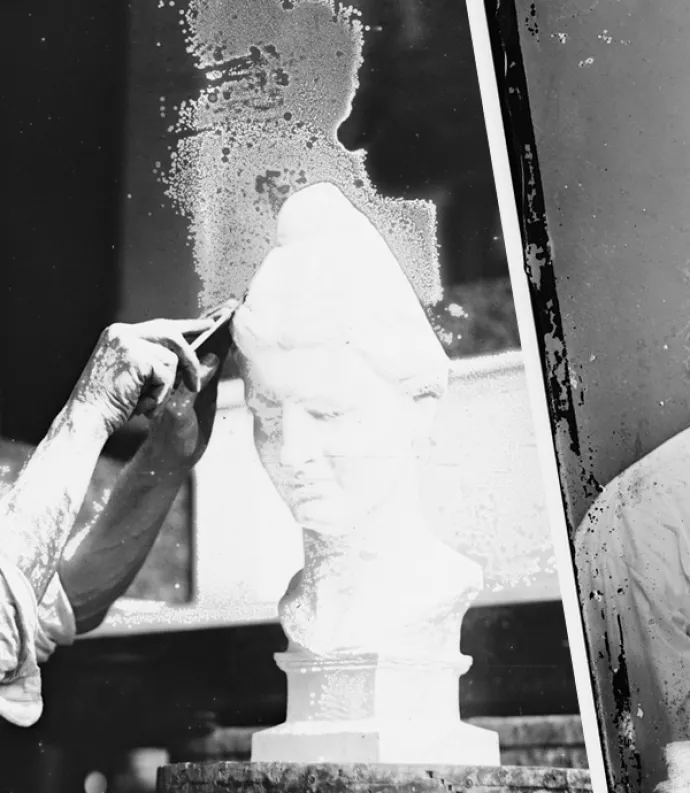 man chiseling with Whitman