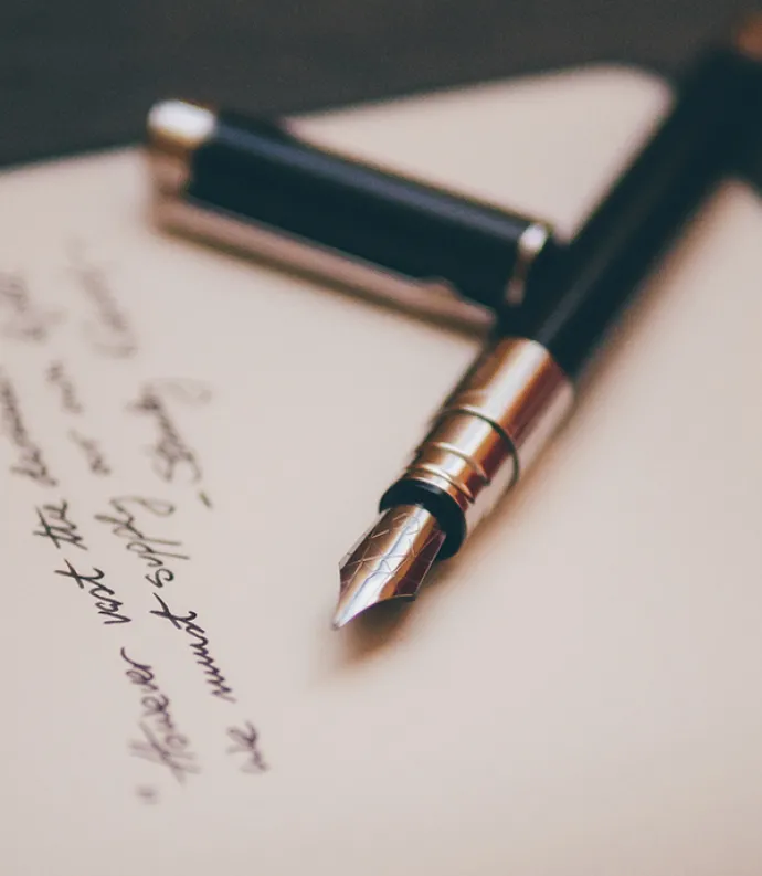 Header Graphic: Felt pen on top of paper dotted with notes | Image Credit: Unsplash