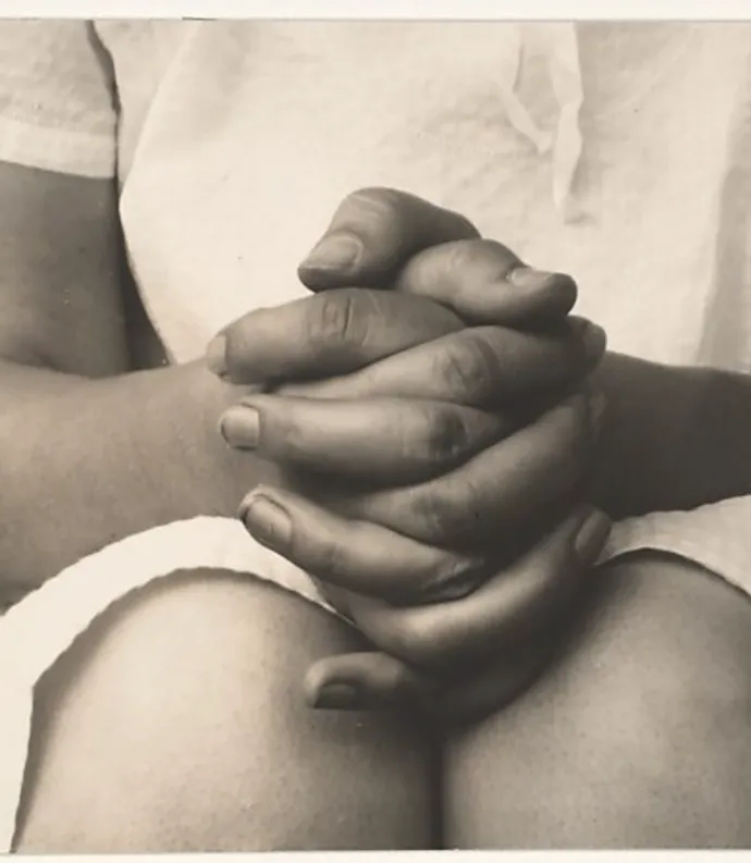 photograph of a woman's folded hands
